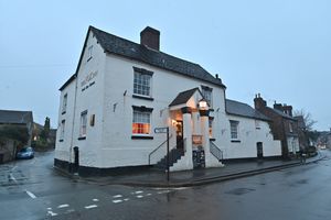 The pub is a distinctive one, cream painted with the big sign