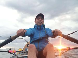 Man rowing across an ocean