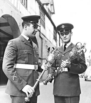 March 1961: 'The mayoral mace bearers of Bridgnorth are the only ones in the country to wear RAF uniform when heading civic processions through the town. Corporals Graham Murrell (left) and Thomas Howard, drill instructors, have just been given this official appointment in token of the close ties between the town and the nearby RAF station. The honour has become a tradition since 1951, when the freedom of entry to the town was conferred on the station, where thousands of men have undergone their initial training.'