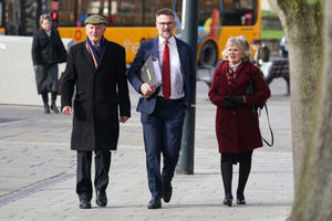 Bargain Hunt auctioneer Charles Hanson (centre) outside Derby Crown Court