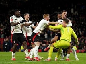 Fulham players celebrate winning the penalty shootout