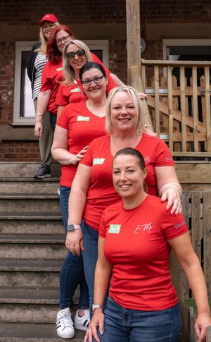 Visitors to the Wear it Red Day, including Pru, second from front 