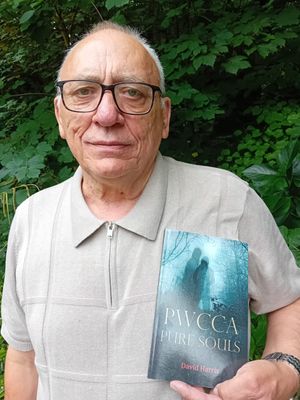 David holding hid debut novel