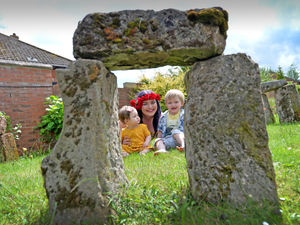 Supporting image for story: Seeing in the summer solstice at village's 'mini-Stonehenge'