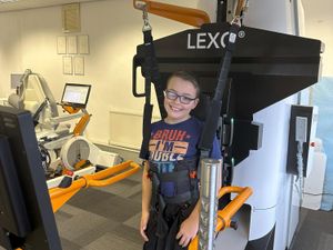 A young patient at Complete Neuro Rehab benefits from the innovative robotic treatment.