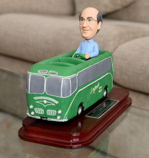  A bus carrying a model of Geoff he received as a birthday gift
