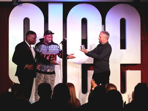 Ryan Lewis receives his award from Darren Harriott and James Cook