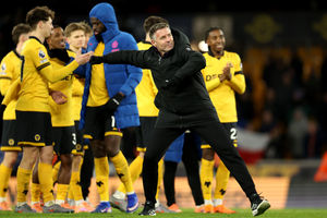 Rob Edwards celebrates with the Wolves players and fans (Photo by Brett Patzke - WWFC/Wolves via Getty Images)