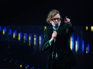 Jarvis Cocker of Pulp performing on stage