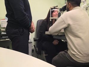 Opticians in Specsavers performing a sight test 