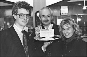 Wolverhampton jewellers T. A. Henn sponsored a charity dinner at the Park House in Shifnal, to raise money for the West Midlands Air Ambulance Service. The photograph shows Bob Seaward receiving a cheque from John Henn (left) and his wife, Julia.