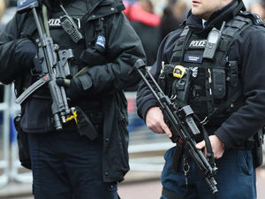 Supporting image for story: POLL: Should all police officers carry guns on a regular basis?