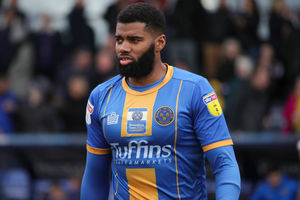 Ethan Ebanks-Landell of Shrewsbury Town with a Shrewsbury Town in the Community logo on his shirt (AMA)