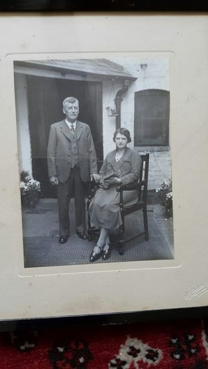 George and Annie Mary Pipe (née Collings) outside the back door of No. 82 Lower Corve Street, accessed via steps down from St. Mary’s Lane. Date unknown.
George and Annie Mary Pipe ran the family haulage business, delivered firewood and bricks from the brickworks at Fishmore, kept horses and milking cows on their farm, (where St. Mary’s Mews now is), and supplied milk locally. Their son, Stan, owned several properties in Lower Corve Street. Photograph courtesy of Joan Pipe.