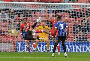 Priestley Farquharson defends for Walsall