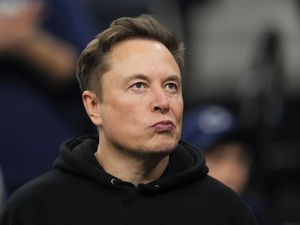 Elon Musk attends the finals at the NCAA wrestling championship in Philadelphia