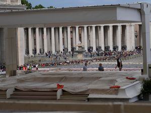 Workers set up the altar for the funeral ceremony of Pope Francis, in St Peter’s Square at the Vatican