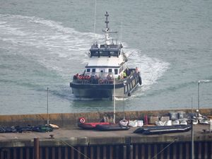 A group of people thought to be migrants are brought in to Dover, Kent, on board a Border Force vessel