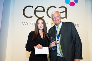 Rosie receives her award from CECA Southern Chair, Alan Cox.