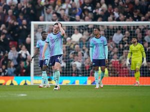 Arsenal players including Declan Rice, centre, react to Manchester United’s opening goal