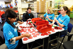 The workers put together the poppies