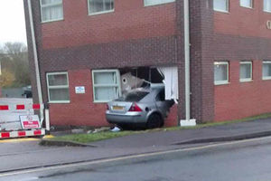 A Mondeo smashed through the wall of a building on Sunday, causing Hawks Green Lane to be shut for nearly 12 hours. Photo: Lucy Anne Forrester
