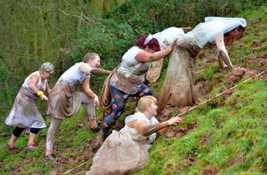 Members of the This Body Runs group help Karen up the hill