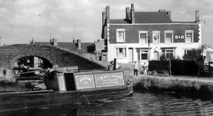 Tipton Green Canal junction by the Beehive pub 1962, the Tipton Green locks branch was opened in 1805 but officially abandoned in 1960 and the Beehive closed in 1978.