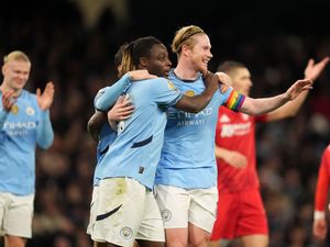 Kevin De Bruyne celebrates with Jeremy Doku