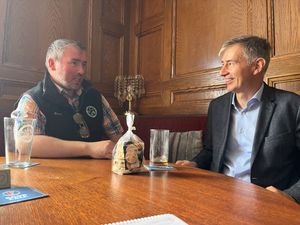 Mr Witherden and Mr Leitner chatting in the Dolphin - on the Welsh side of the border.