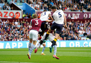 Aston Villa's Matt Targett (left) battles for the ball with Everton's Yerry Mina