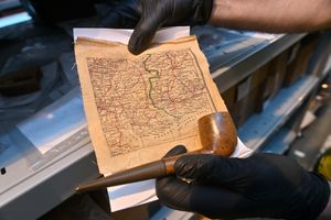 A map that was hidden inside a pipe, and one of several items that were given to servicemen to help them escape and return to allied territory