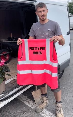 Harry Smith-Haggett with his 'Pretty Pot Holes' hi vis.