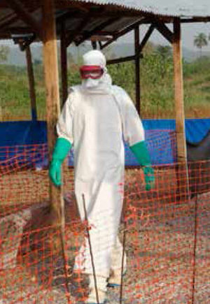 Samuel Lauder in a full protective suit