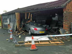 Supporting image for story: Motorist 'parks' his Bentley in the side of a shed at Newport hotel