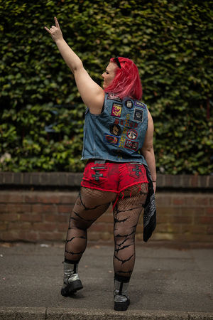 Music fan Nerissa Chater, wearing her father's denim jacket from the 1980s, arrives to attend British rock band Black Sabbath's "Back to The Beginning" concert, Ozzy Osbourne's final ever gig as Black Sabbath's frontman at Villa Park in Birmingham, central England on July 5, 2025. Osbourne, who revealed in 2020 that he has Parkinson's disease, will join Tony Iommi, Geezer Butler and Bill Ward for the all-day "Back To The Beginning" show in Birmingham, central England, where the heavy metal giants formed in 1968. (Photo by Oli SCARFF / AFP) (Photo by OLI SCARFF/AFP via Getty Images)          