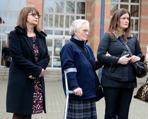 Family members outside the court