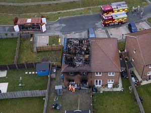 Supporting image for story: Remaining hotspots extinguished at scene of house fire that killed child