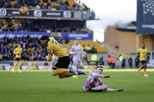 Iwan Morgan tackles Matt Doherty during the FA Cup 3rd round game between Wolverhampton Wanderers and Shrewsbury Town at Molineux on 10th January 2026