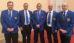 Suited and booted - Ritchie (first left) gets kitted out in Turkey with the rest of the Scotland squad.