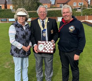 County President Simon Fullard with Consolation Knockout winners Lynda Gollins and Ian Hughes