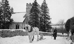 A horse pulls a milk churn on a sledge past the church at Rhydycroesau, near Oswestry in 1955. Picture courtesy of the Geoff Charles Collection, the National Library of Wales.