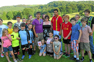 Aprils parents Paul and Coral Jones with Wales manager Chris Coleman and youngsters from Machynlleth