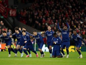 Paris St Germain players run from the centre circle to celebrate their penalty shoot-out victory over Liverpool in the Champions League