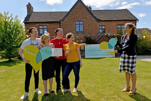 Elodie Home from Severn Hospice accepts the £120,000 donation