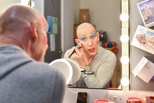 Andrew Ryan prepares to go on stage as Dame Trott. Photo: Simon Hadley