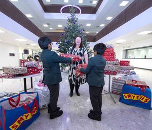 Adopted brothers, eight and five, have inspired their school friends to donate Christmas gifts to children in need, spreading holiday cheer in Wolverhampton.