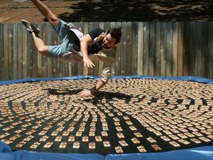 Supporting image for story: Watch this guy dive into 1,000 mousetraps for no apparent reason 