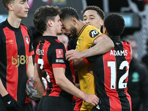 Matheus Cunha headbutts Milos Kerkez (Photo by JUSTIN TALLIS/AFP via Getty Images)          