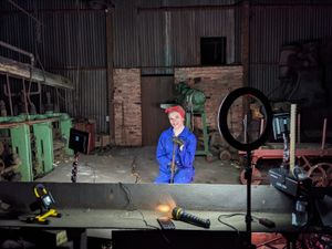 A factory worker showcases roles women played in the Second World War